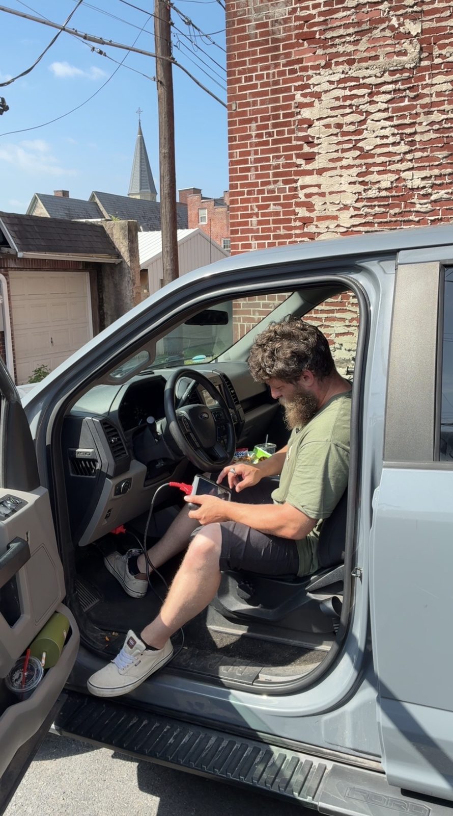 Running computer diagnostics with a scan tool in the cab of a Ford F-150
