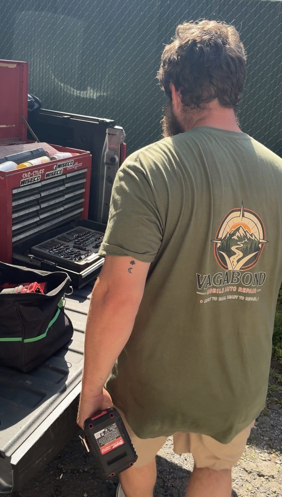 Professional tool chest and tools set up on the tailgate of the work truck